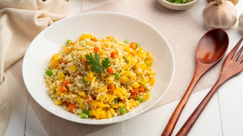 fried cauliflower rice with veggies and garnish
