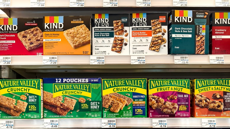 Kind and Nature Valley granola bars on a grocery store shelf