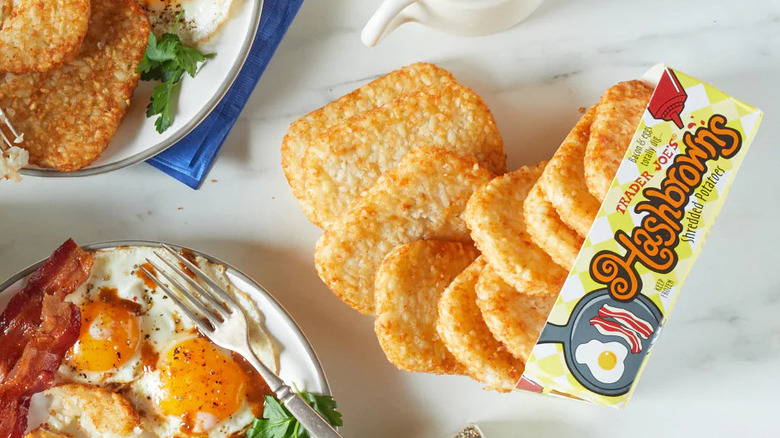 Trader Joe's frozen hash browns next to breakfast plates