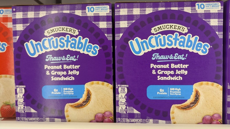 Uncrustables boxes on grocery store shelves