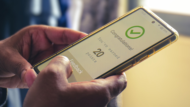 Man earning points on mobile loyalty program