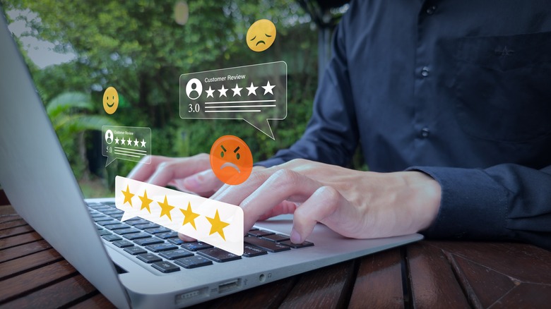 Person leaving reviews on laptop