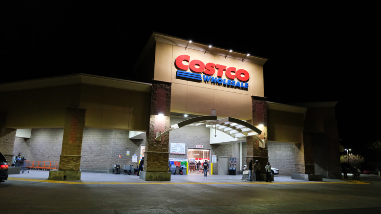 A brightly-lit Costco store front at night
