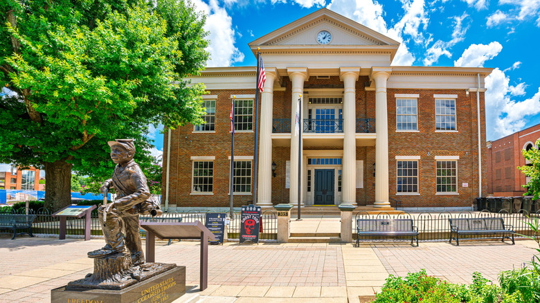 courthouse with statue in front of it