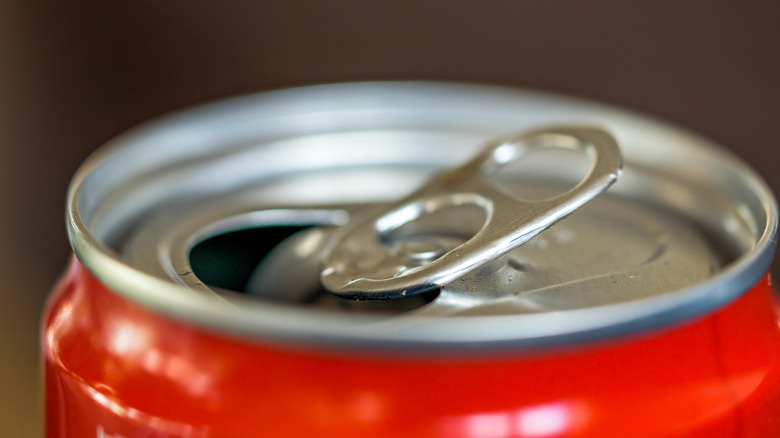the open top of a can of soda