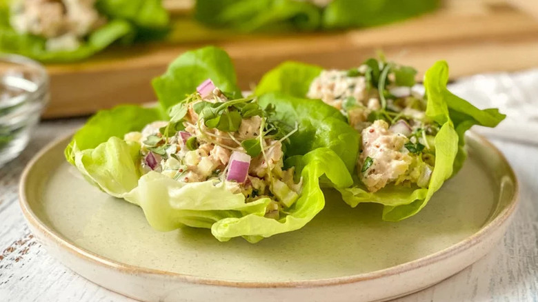 two Tuna Lettuce Wraps on a stoneware plate