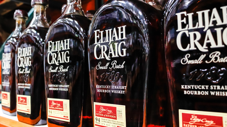 5 bottles of Elijah Craig Small Batch bottles lined up on store shelf