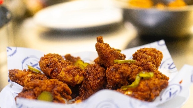 Fried chicken with pickle garnishes from Nexus Brewery
