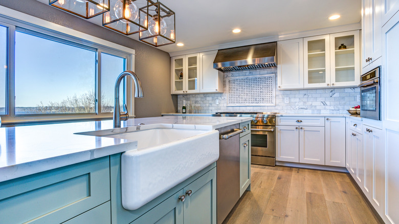 Farmhouse sink in a blue kitchen