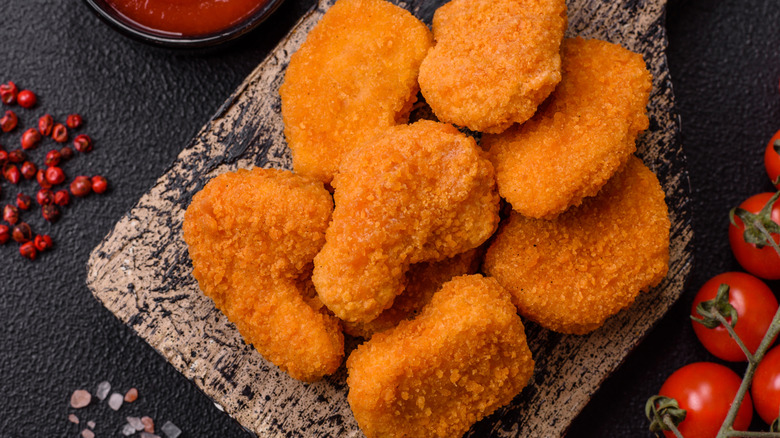 Chicken nuggets on a brown surface