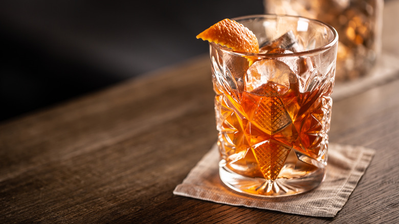 Old fashioned drink with orange peel