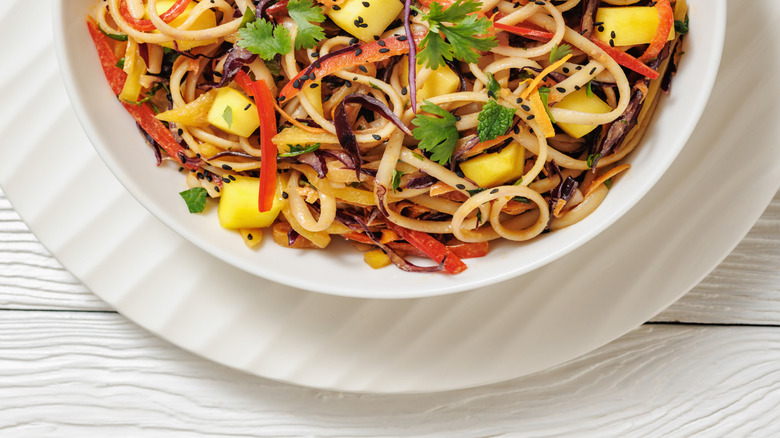 Noodle salad with fruits and cilantro