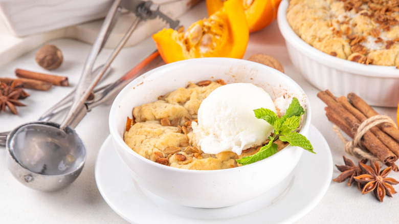 Dish of pumpkin cobbler with ice cream