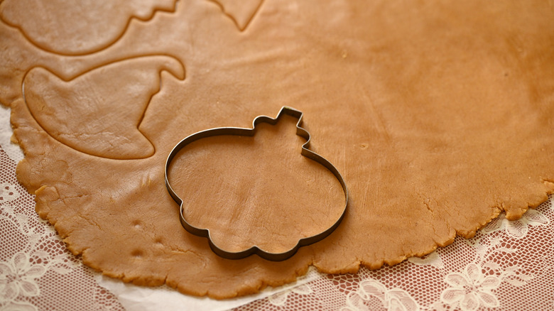 Cutting out Halloween gingerbread cookies