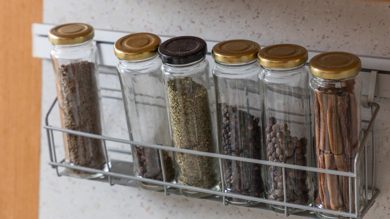 Rack lined with spice jars