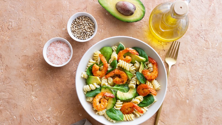 Pasta salad with shrimp, avocado, and baby spinach