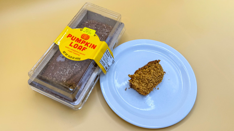 Package of Trader Joe's Pumpkin Loaf next to slice on plate
