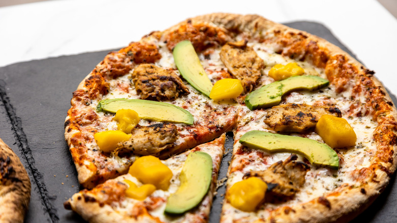 Mango pizza with avocados
