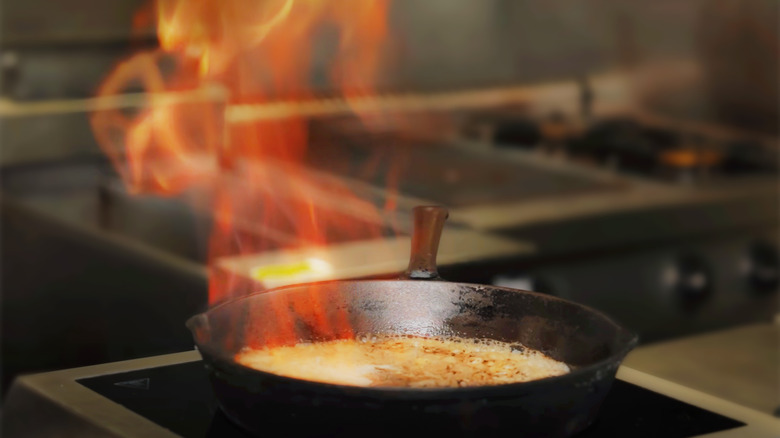 Pan with alcohol cooking and deglazing