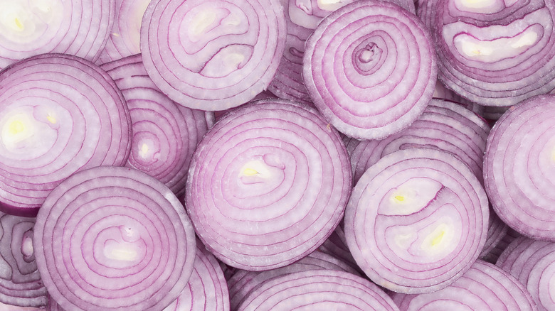 Close-up of raw red onion slices