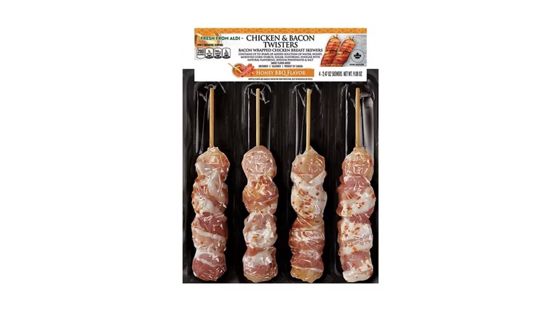 A package of four chicken skewers wrapped in bacon
