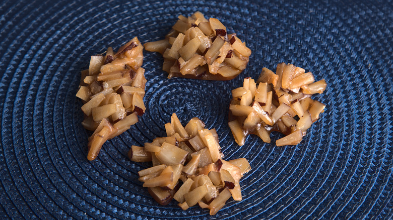 Coconut drops on a blue straw mat