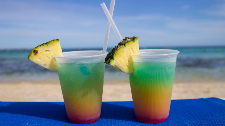 Two Bob Marley cocktails with a view of the beach in the background