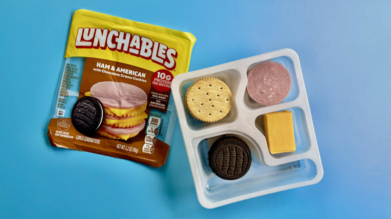 Ham & American with Chocolate Crème Cookies in an opened package on a blue surface