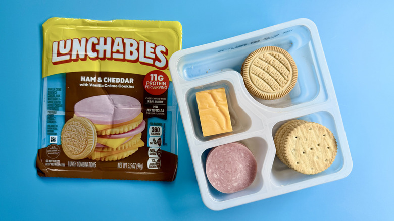 Ham & Cheddar with Vanilla Crème Cookies in an opened package on a blue surface