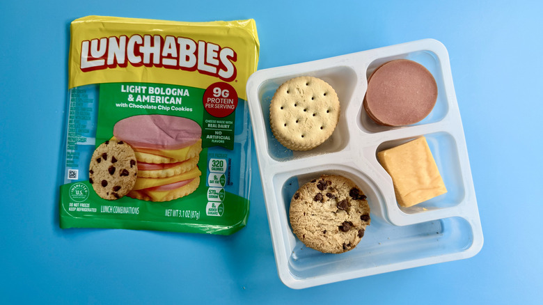 Light Bologna & American opened package on a blue surface