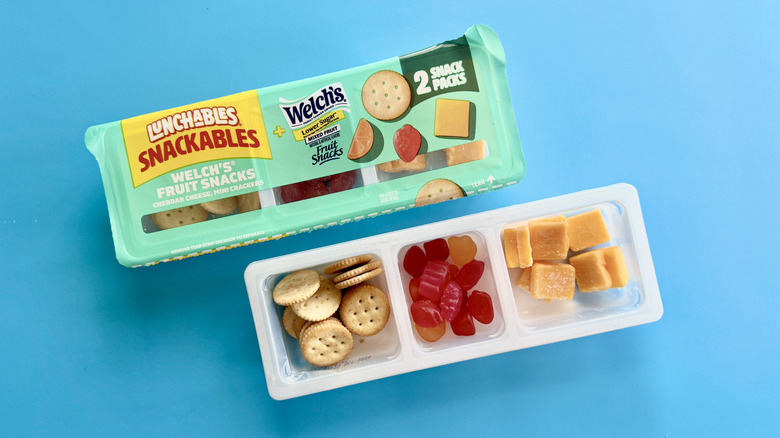 Snackables with Welch's Fruit Snacks in a 2-pack on a blue surface