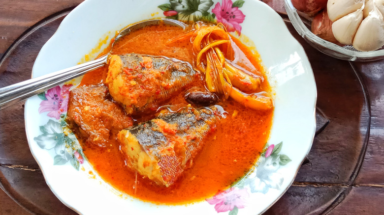 A bowl of asam pedas with fish.