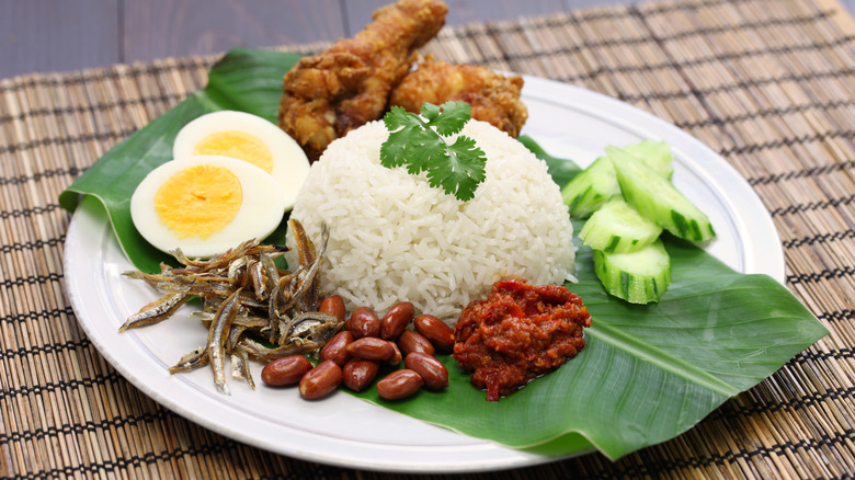 A plate of nasi lemak on a table.