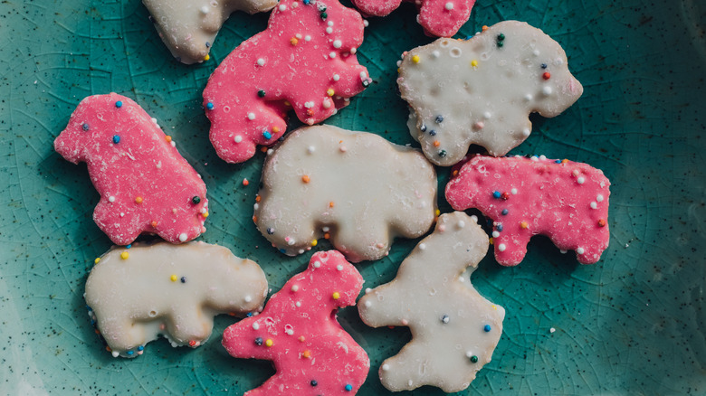 A group of loose frosted animal cookies