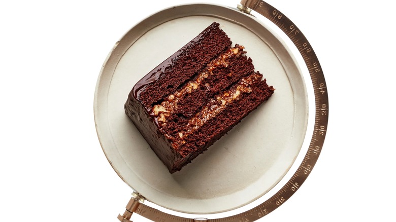 A piece of German chocolate cake on a scale