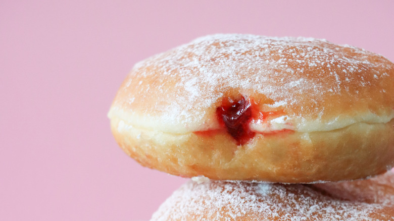 Jelly doughnut atop another jelly doughnut