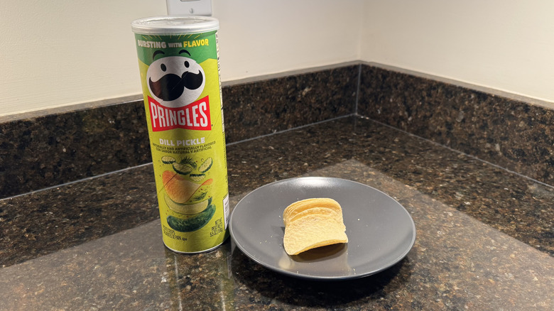 Pringles can on countertop with chips