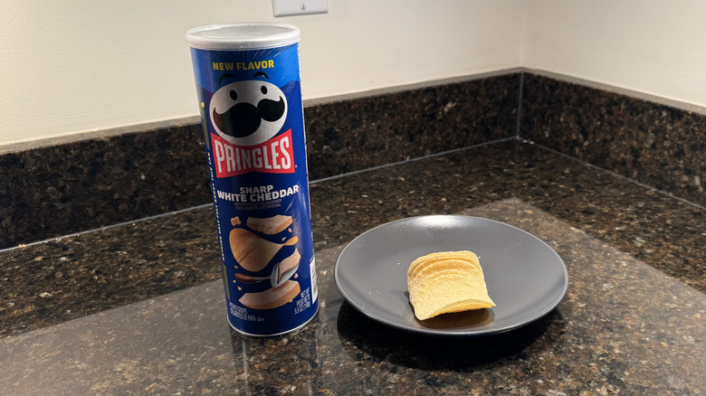 Pringles can on countertop with chips