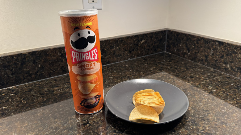 Pringles can on countertop with chips