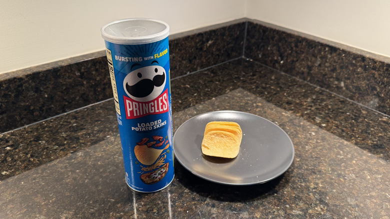 Pringles can on countertop with chips