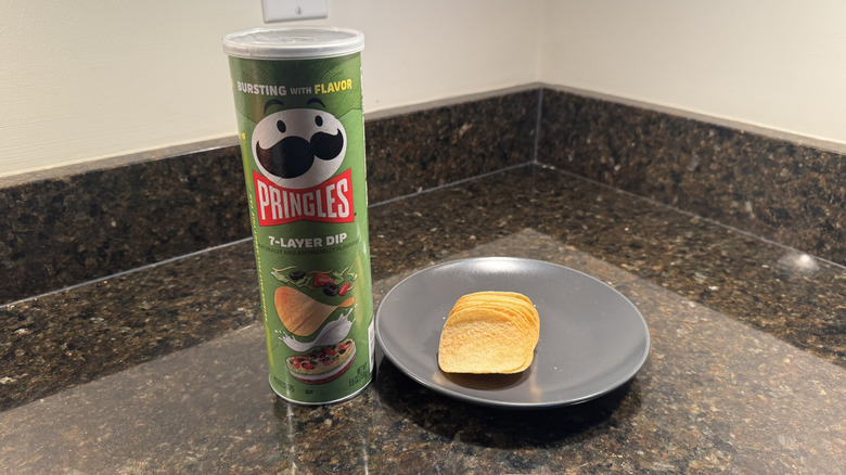 Pringles can on countertop with chips