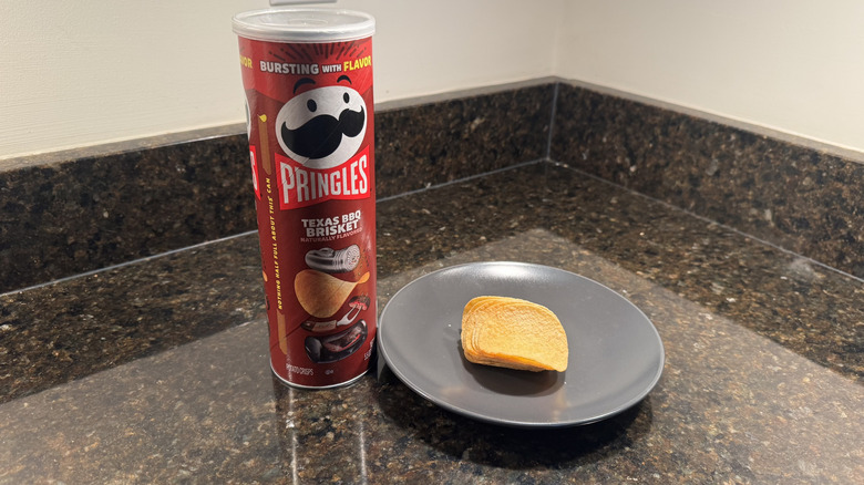 Pringles can on countertop with chips