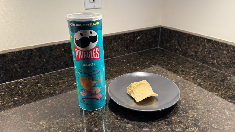 Pringles can on countertop with chips