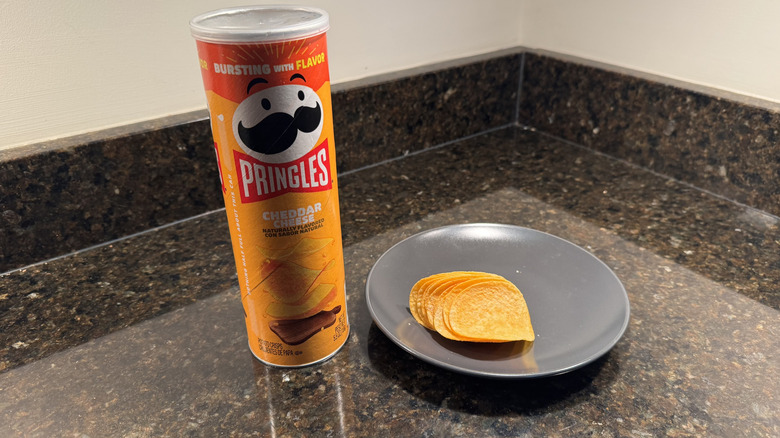 Pringles can on countertop with chips