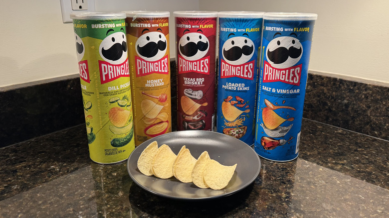 Pringles cans on countertop with chips