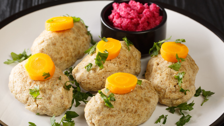 Gefilte fish spread on serving plate