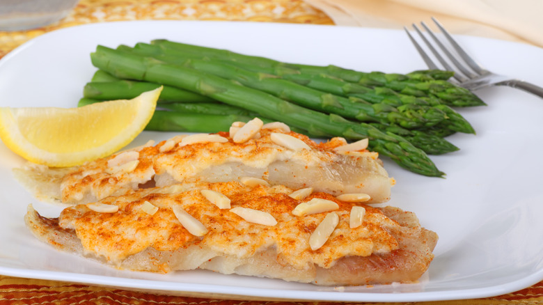 Close-up of fish topped with crab