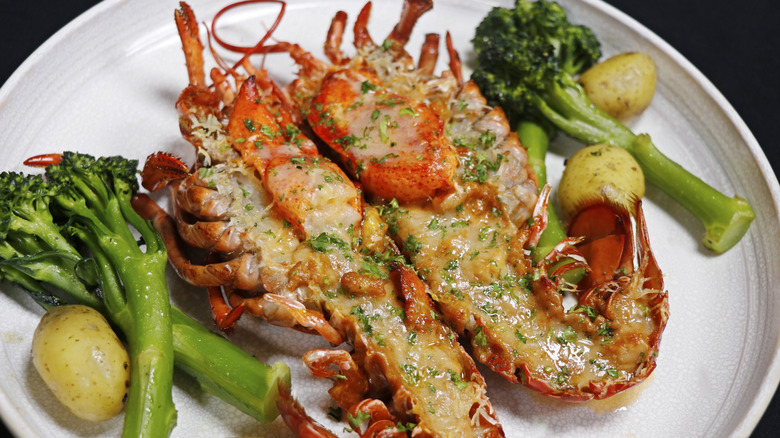 Halved lobster stuffed with cheese sauce