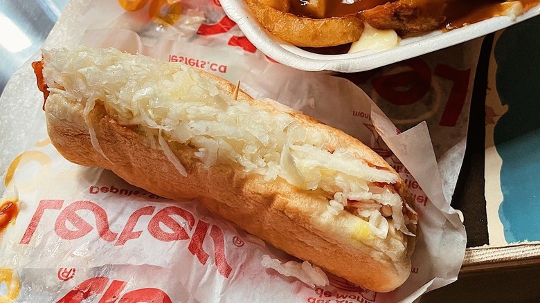 A steamie hot dog with cabbage