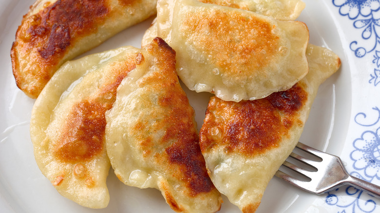 Pierogi on a plate with a fork